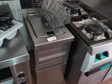 a kitchen with a stove, oven, sink and dishwasher