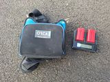 a bag with batteries and a charger on the ground
