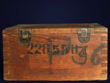 a wooden box with writing on it on a blue background