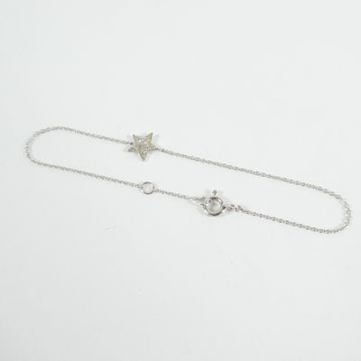 a close up of a chain with a star and moon on it