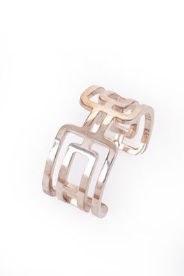 a close up of two rings on a white surface