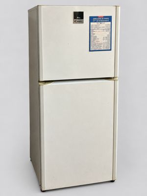 a white refrigerator with a blue sticker on it