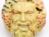 an image of a ceramic head of a man with a beard