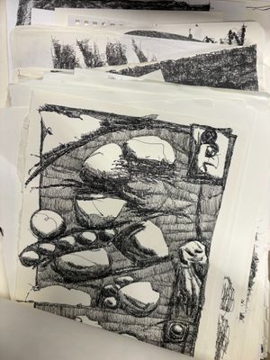 a black and white drawing of rocks on a piece of paper