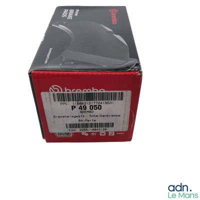 a red box with a black and white label and a barcode on it