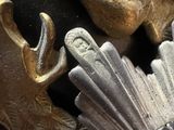 a close up of a metal object with a bird on it