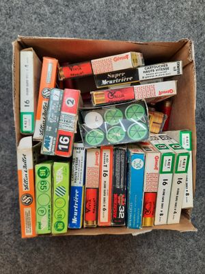 a box full of cigarettes and cigarettes on the floor