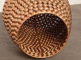 an image of a vase made of metal balls