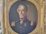portrait of a man in a military uniform in a gold frame