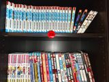 a book shelf with many dvds on it