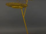 yellow metal table with a flower on top of it on a gray background