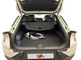the back of a car with the trunk open and a car charger in the trunk