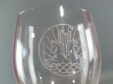 a person holding a wine glass with a picture on it