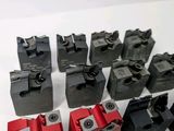 a lot of different types of clamps on the table
