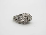a close up of a silver ring on a white surface