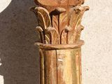 a tall wooden column with a decorative design on it