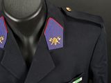 an uniform worn by a man in uniform with medals on his lapel