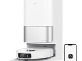an image of a white air purifier with a remote control next to it