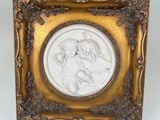 an image of a picture of a woman and child in a gold frame