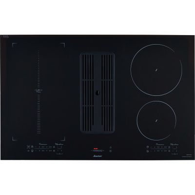 a close up of a black stove top with three burners