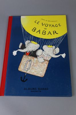 a book with a picture of a couple of mice flying in a balloon