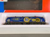 a blue and yellow train on display in a box