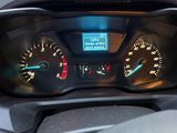 a close up of a car dashboard with a speedometer and gauges