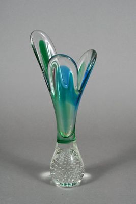 a glass vase that has a blue and green design on it
