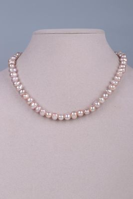 a pink pearl necklace on a mannequin mannequin mannequin mannequin mannequin mannequin mannequin mannequin manne
