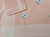 a close up of a table cloth with flowers on it