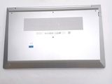 a silver laptop computer sitting on top of a white table