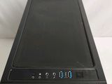 a close up of a black computer on a white surface