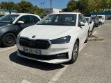 a white car parked in a parking lot next to other cars