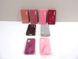 several cell phones are lined up in a row on a white surface