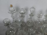 a lot of glass vases that are sitting on a table