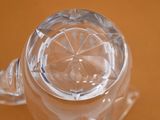 a close up view of a glass of water on a table