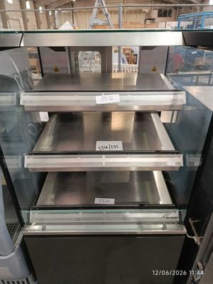 a glass display case with a lot of food inside of it