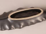 an image of a metal object with a wooden frame on it