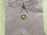 purple dress shirt in a plastic bag on a table