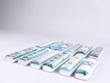 several toothbrushes are lined up in a row on a white surface