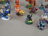 many figurines of different types and colors on the table