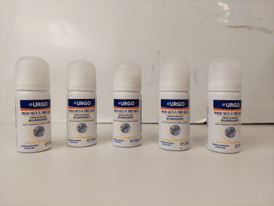 four different types of deodorant sprays are lined up on a counter