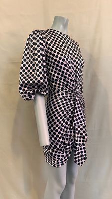 a mannequin mannequin wearing a black and white checkered dress