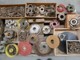 a box full of assorted metal parts on the floor