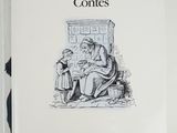 an old book with a picture of a woman sitting on a bench