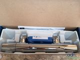 a box with a fountain pen and other items in it
