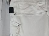 the back of a pair of white pants with a tag on it