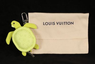louis vuitton keychain with a turtle on top of it