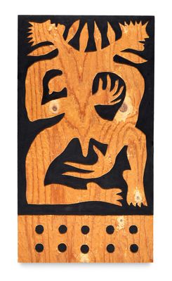 painting of a man and a woman on a wooden plaque