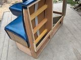 a blue chair that is sitting on top of a ramp